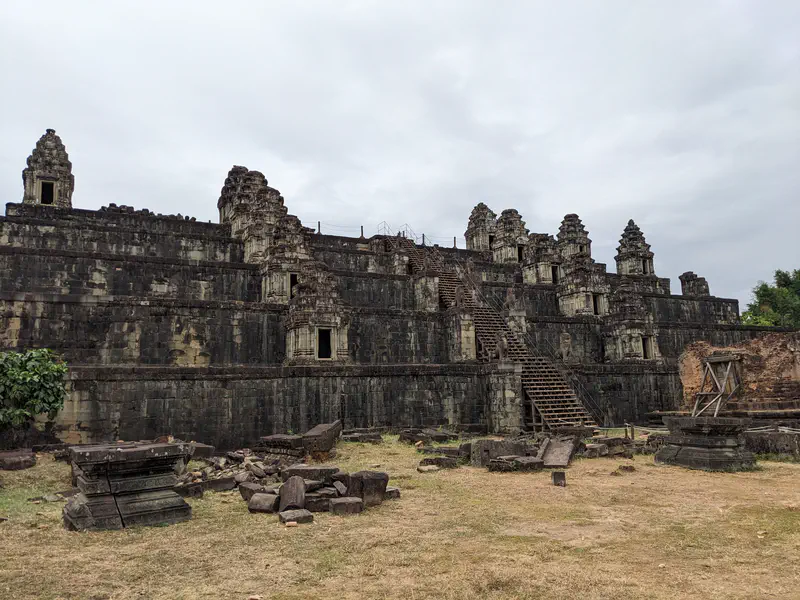 Large stepped stone temple with staircases leading to multiple towers.