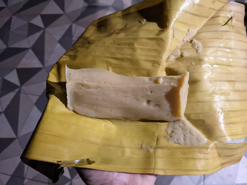 Steamed rice cake on a banana leaf.