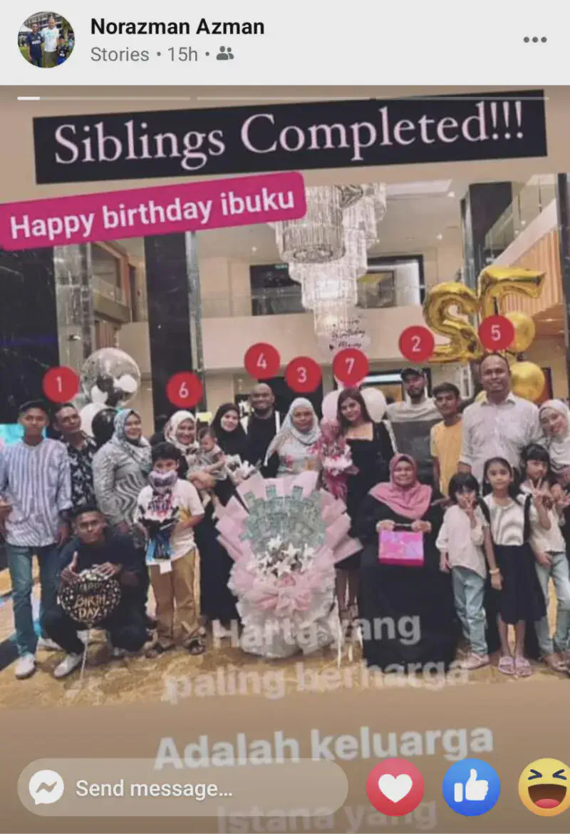 Large family group photo in a hotel lobby celebrating a birthday with balloons and decorations.