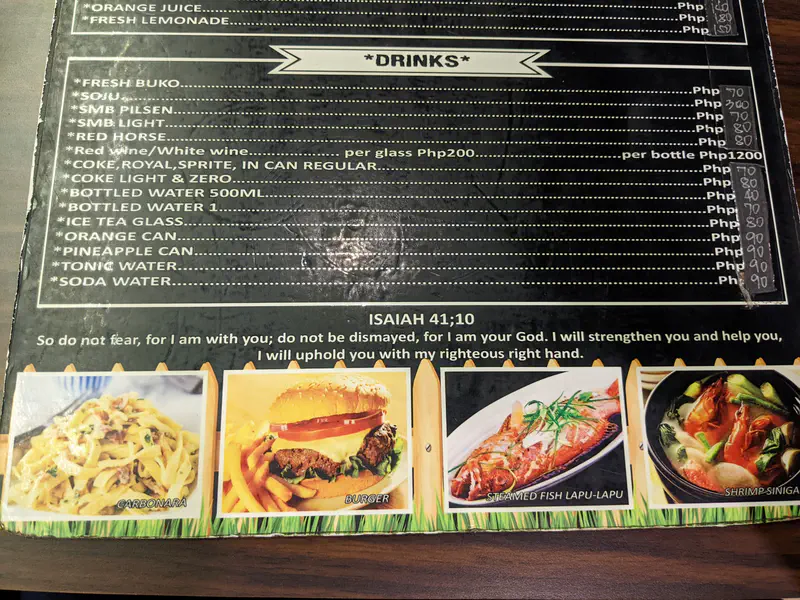 Restaurant menu page with a Bible verse, drinks list, and photos of pasta, burger, fish, and shrimp dishes.