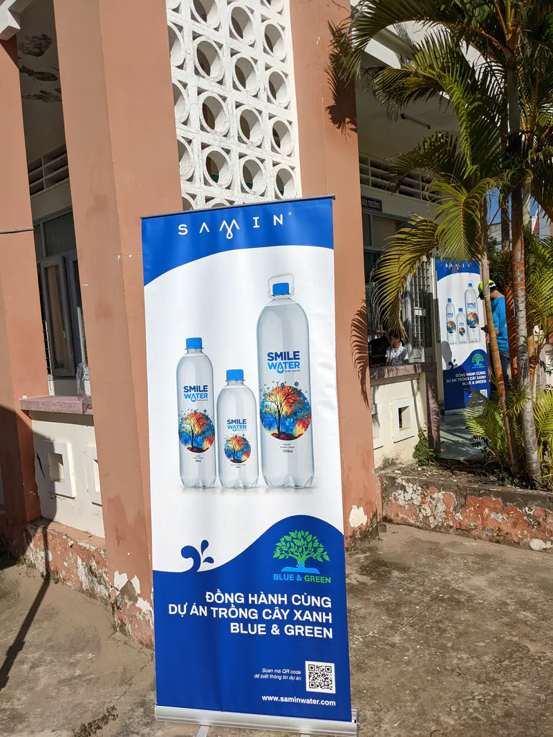 Promotional banner for Smile Water supporting the Blue & Green tree planting project.